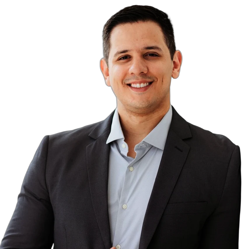 Dr. Gabriel Perotoni, cirurgião vascular, de blazer, sorrindo